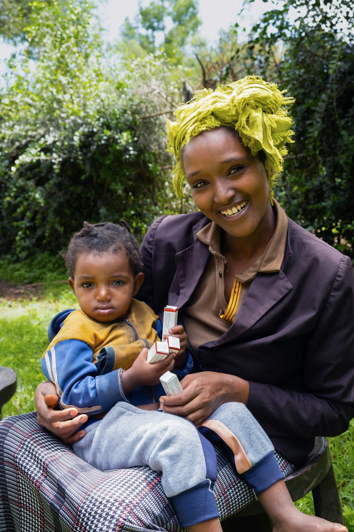 mother and son posing for photo with antibiotics