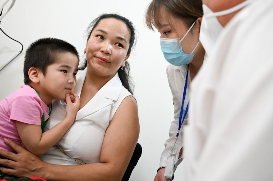 Girl before surgery with mother