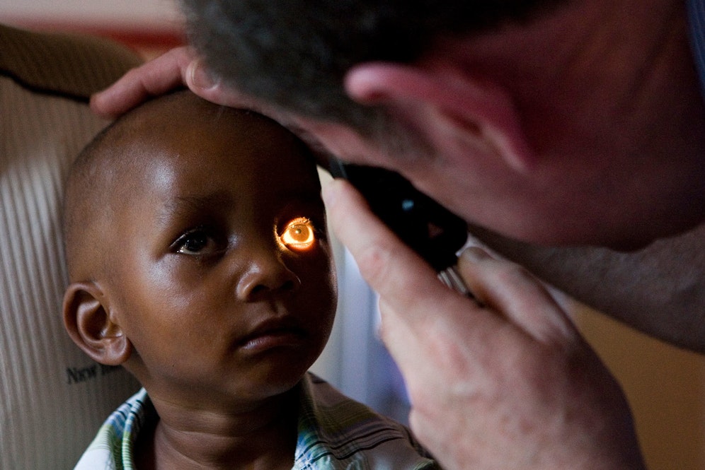 A child receiving eye treatment in Zambia