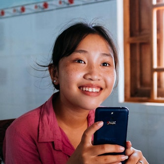 Trinh sat in her house following a successful operation to correct strabismus