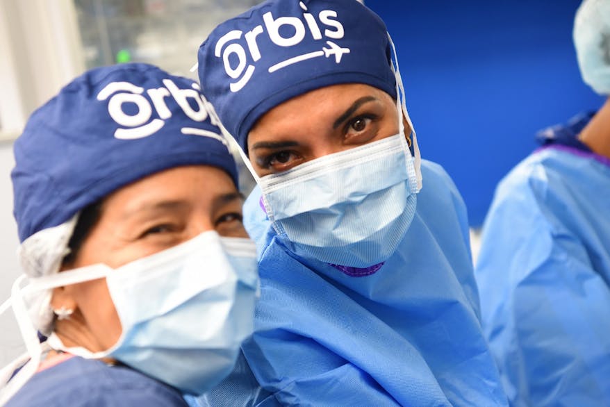 Flying Eye Hospital staff nurse Elisa Urruchi, with Volunteer Faculty scrub nurse Ms. Irma Casale