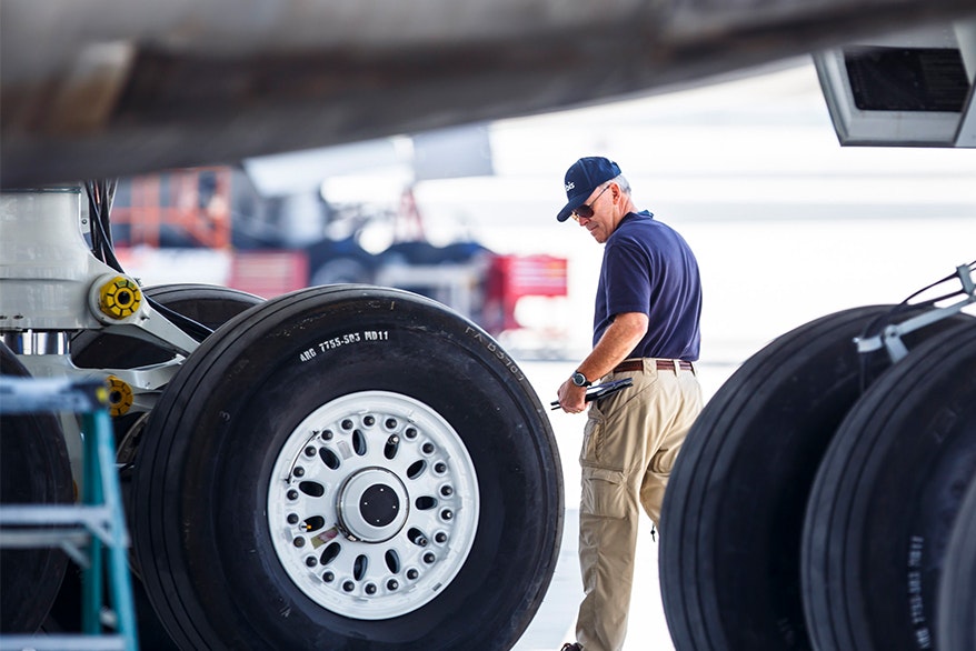 Flying Eye Hospital volunteer Captain Gary Dyson inspecting the plane