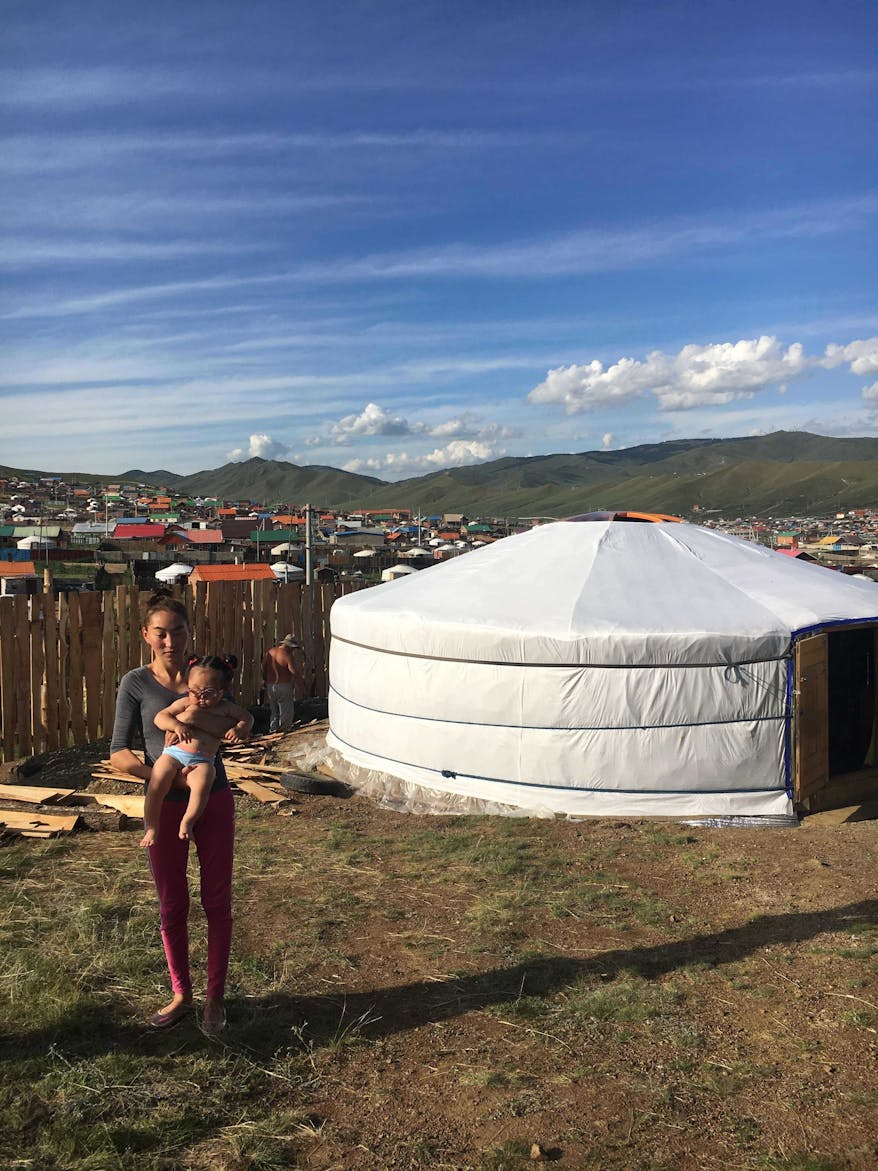Marla and her mother outside their traditional ger in rural Mongolia