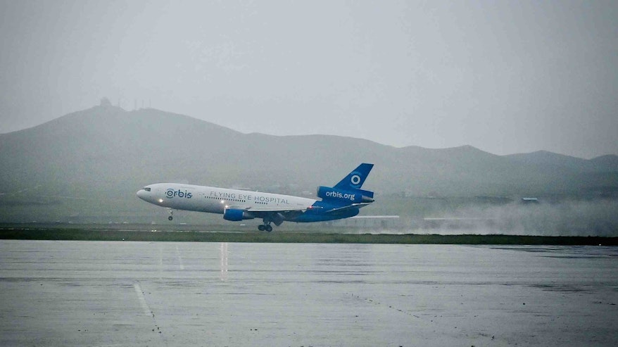 Orbis Flying Eye Hospital landing in Ulaanbaatar, Mongolia on a foggy day.