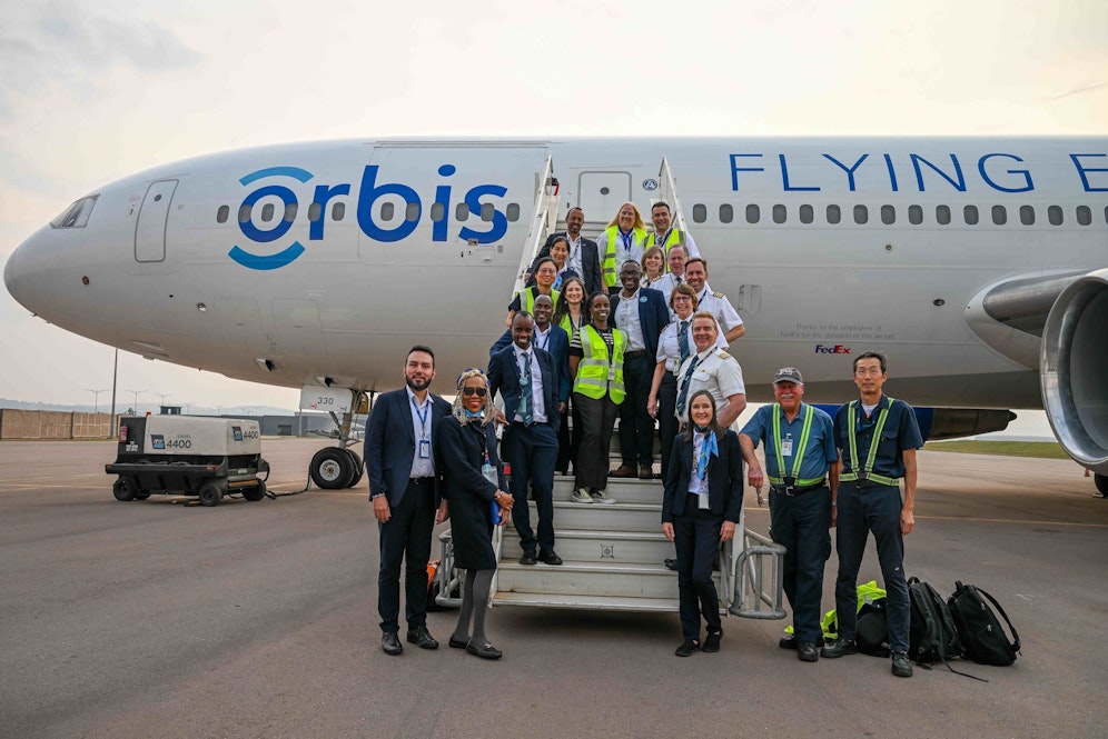 Staff standing outside of the Flying Eye Hospital in Rwanda